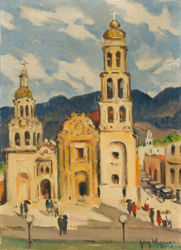 A view of Saltillo Cathedral in Coahuila, Mexico. Dark blue mountains are in the distance with white clouds in a blue sky. Figures are in the foreground and cars line a street on the right.