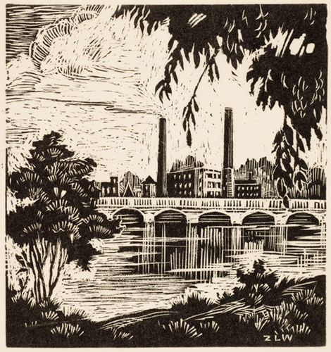 The bank of a river frames a view of a bridge. There is a factory behind the bridge, including two smoke stacks.