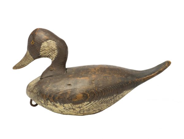 A decoy painted wood with brown spotted accents over bare wood and white behind the eyes.