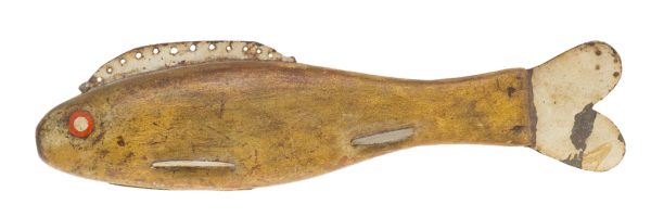 A gold painted fishing lure with tan fins and tail, red painted eyes.