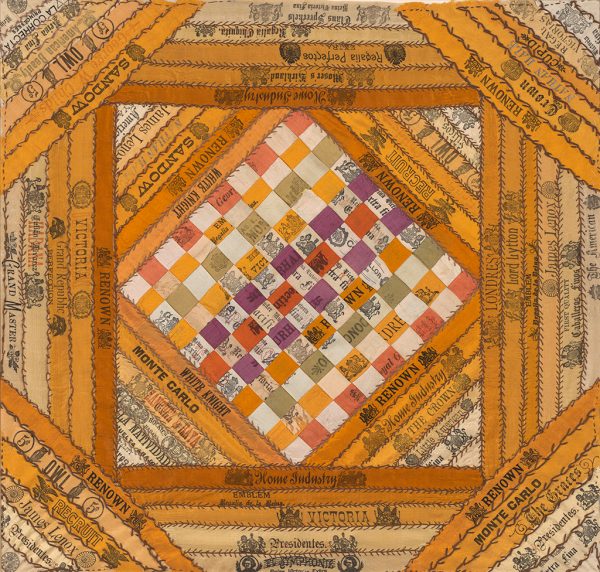 Cigar ribbons in red yellow, green, purple and white are interwoven at the center and pieced in a log cabin quilt pattern around the edges. The cigar bands are attached to each other with black thread in a version of blanket stitches.