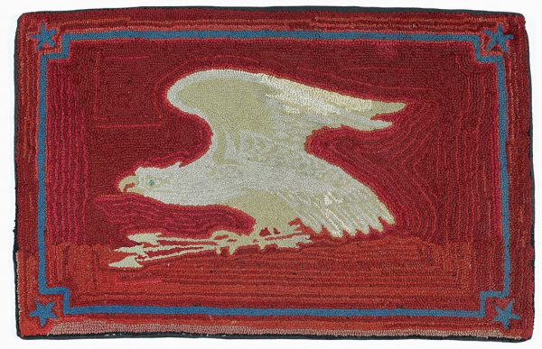 A white eagle and arrows on a red ground with blue boarder and corners.