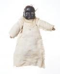 The head is molded composition with painted red eyes. The body is stuffed fabric. The baby wears a homespun white jumper, the top has a crocheted edge.
