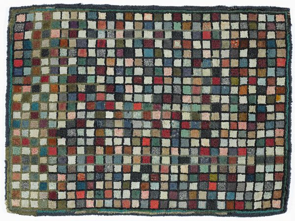 A multi-colored hooked rug with dark border, 1
