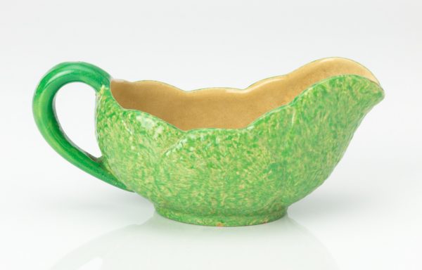 Majolica creamer in leaf pattern, green outside, cream inside. The green is a spatterware application over the cream.