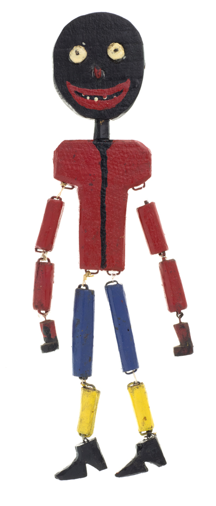 The smiling figure in a red shirt, blue and yellow legs and has articulated joints connected by string.