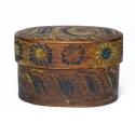 Brown oval box with hand-painted surface decoration. The construction is Norwegian Tine style, one-piece, wood-laced seams.