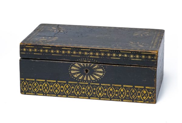Dark green box with gold stencil decoration. The interior is a bright yellow paper.