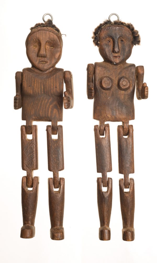 The male and female pupptes are not clothed. They have articulated shoulders, hips and knees and wool hair.