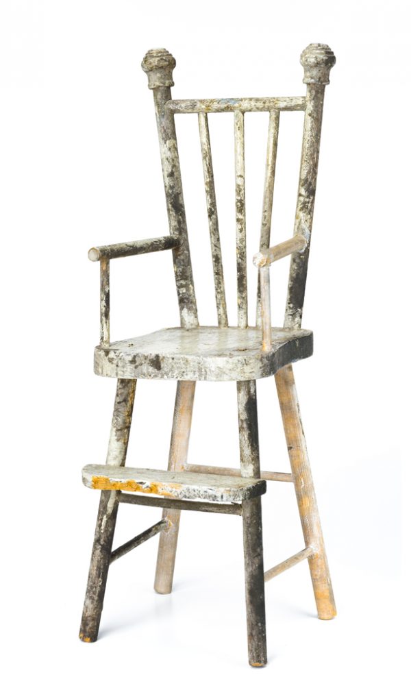 Doll's high chair. The back has three spindles, stiles, arm rests and rungs are all turned straight with a ball finial at top of back.