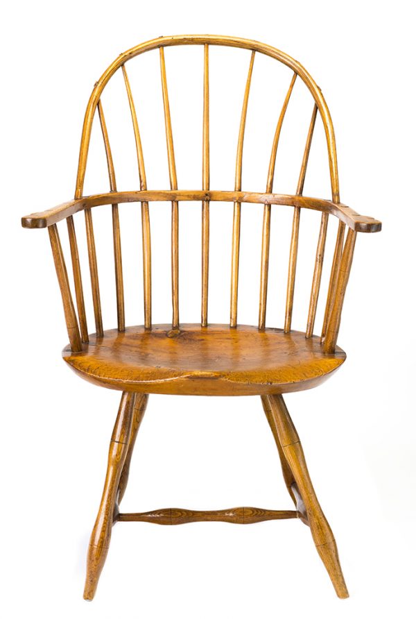 Seven-spindle bow back continuous Windsor arm chair.