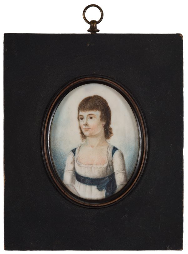 A portrait of a young woman, painted on a very thin oval shaped piece of ivory.
