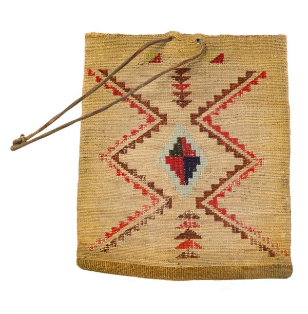 Twinned bag with geometric patterning in wool. The pattern is different on the front and the back. Leather thong strap. Colors of wool are red, brown, green, dark blue, light blue, light green, and blue-grey (two shades).