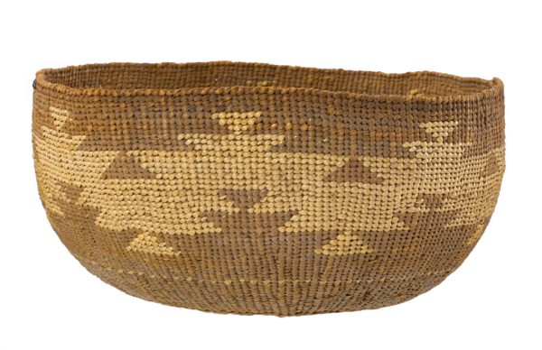 A tightly woven basket with motif of triangular light colored zig-zag shapes on a chocolate brown background.