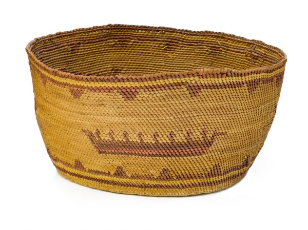 A basket made of twined bear grass and cedar bark. Two whales and men in a long boat chasing them.