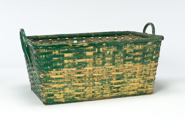 A split wood basket with solid wood bottom. There are two bent wood handle. The outside of the basket is painted green over yellow.