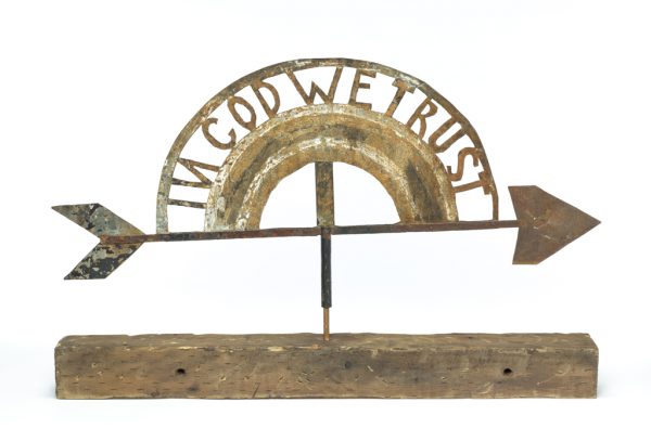 A sheet metal weathervane with the words cut-out