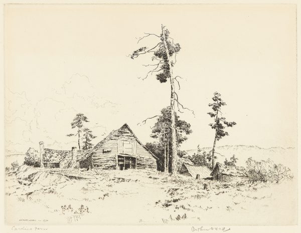 Farmhouse in field with sparce trees around