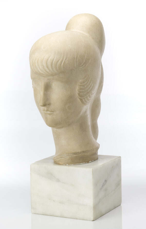 A bust of a woman with calm expression. Her hair is defined by a large Chignon braid down the back, bangs over forehead and ears.