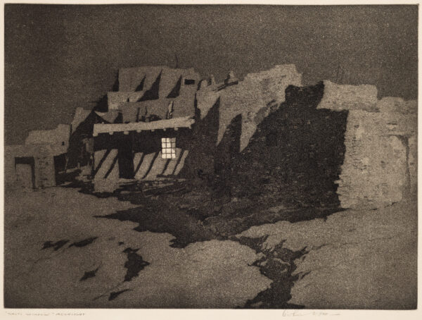An adobe house comunity with one window lit up in the night.