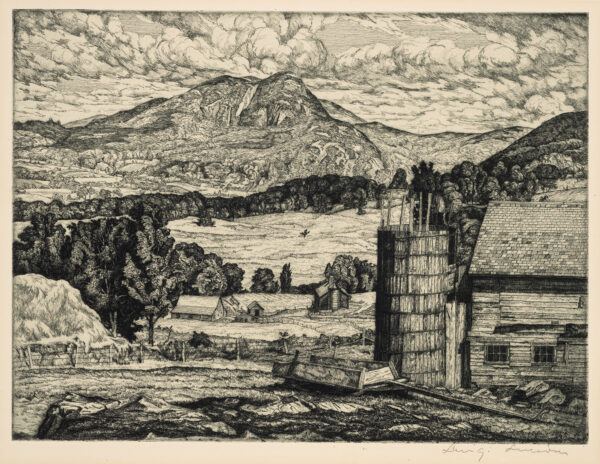 Old farm scene with mountains in the distance.