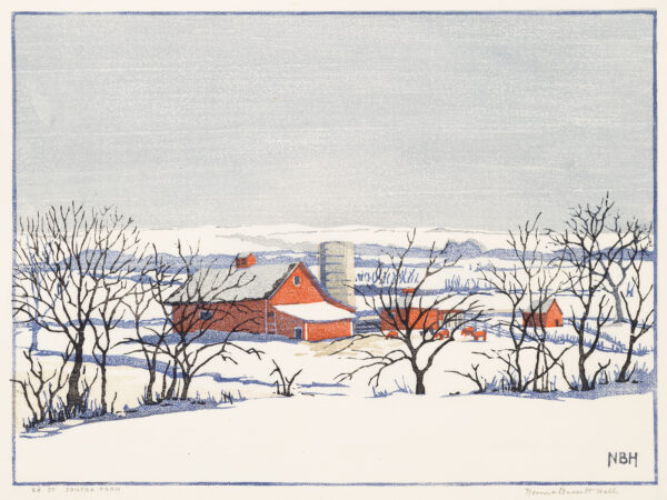 A farm consisting of multiple red buildings, a silo, trees in the foreground and low hills in the background. Snow is on the ground and roofs of the buildings