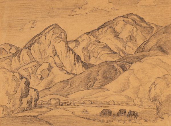A large mountainside is pictured with horses grazing on grass in the foreground.
