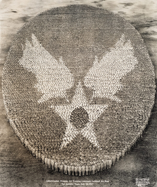Many air training men align to create an insignia when photographed from above.