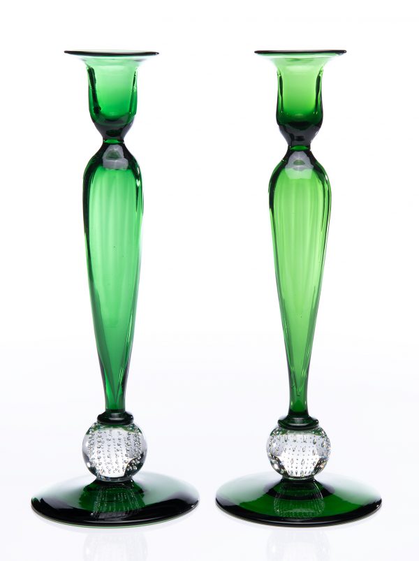An emerald green and clear ball pair of candlesticks