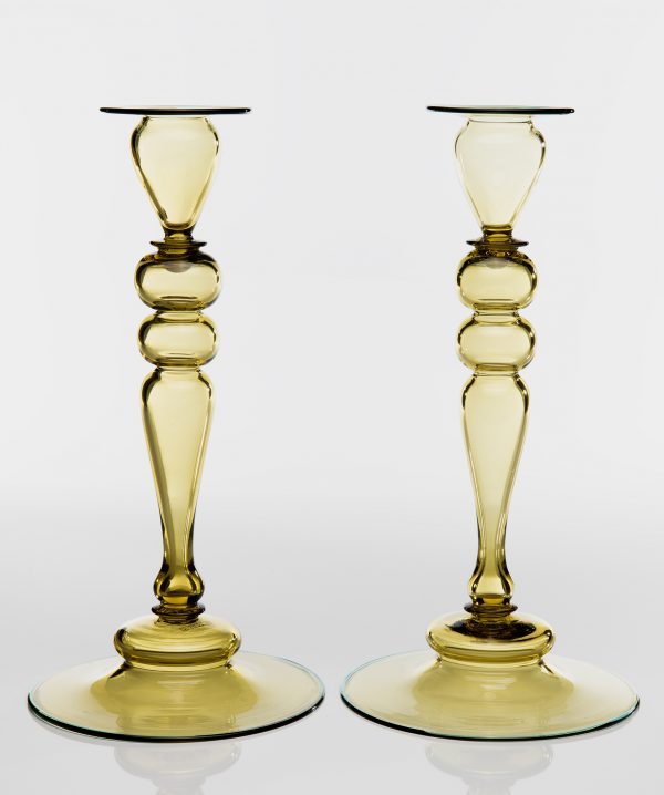 A pair of candlesticks in topaz and blue trim