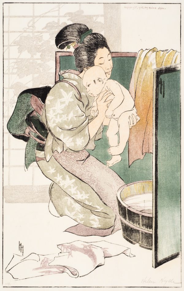 A woman wearing a kimono holds an infant over a tub of water. Towels are on the floor and over the green screen surrounding the bath. A silhouette of leaves can be seen through the background screen.