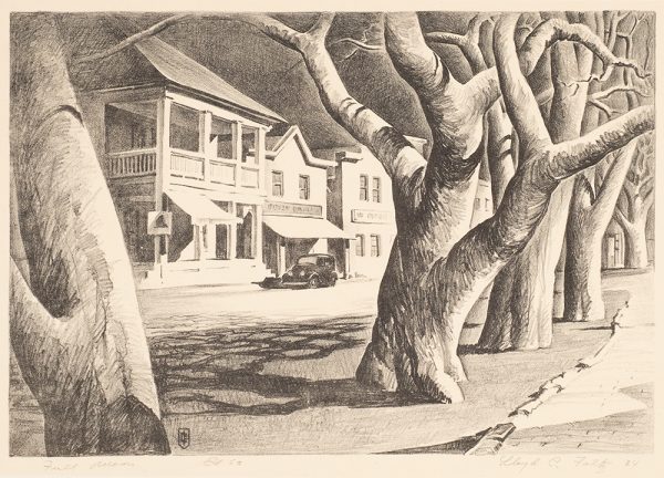 A 1930s car sits in front of two-story buildings with awings. The trees that line the street are in the foreground.