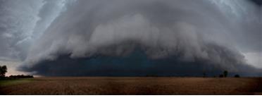 A shelf cloud threatens an empty landscape.