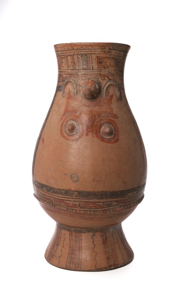 Jar with an effigy of a female and animal head. This jar is a rattle