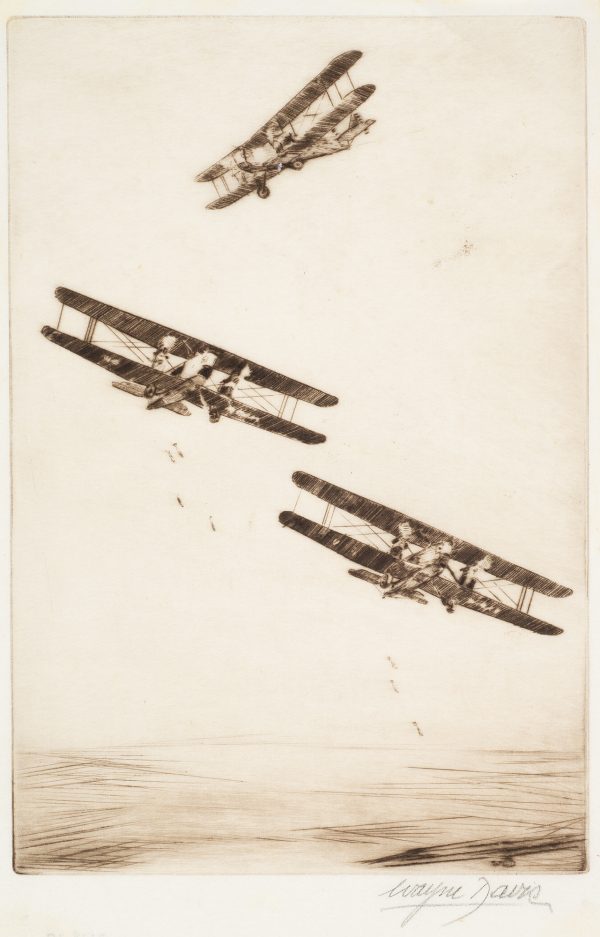 Three bi-planes in the air dropping bombs.