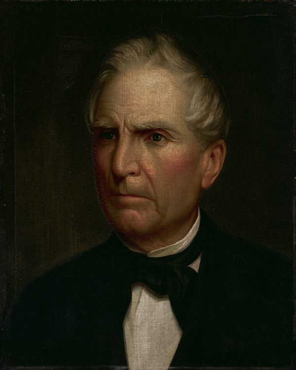 An portrait of an elderly man wearing a white shirt and black tie and coat. William Thomas was the President of the Board of Trustees for MacMurray College, 1863-1889.