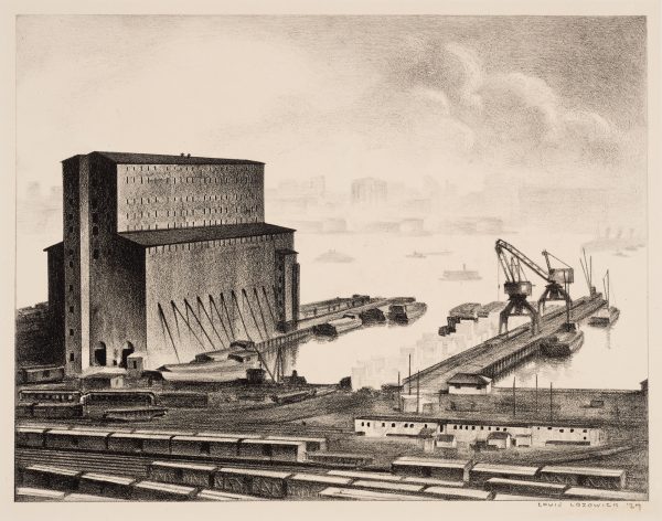 A tall grain elevator is on the left with railroad and cars in the forrground. At center and right are piers and cranes lifting product into boats.