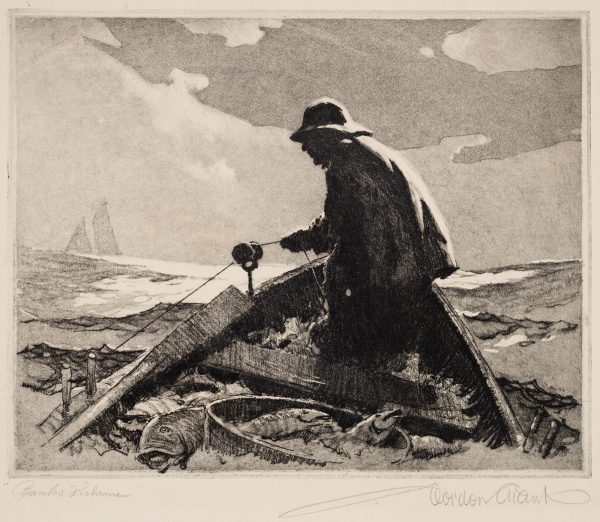 A fisherman in a row boat wears a coat and hat. The boat is full of fish and he is pulling in a fishing net. A sail boat is in the distance on the left