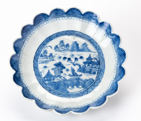 Serving Dish with scalloped rim. Some scallops are pointed. The outer decoration is three flowers.