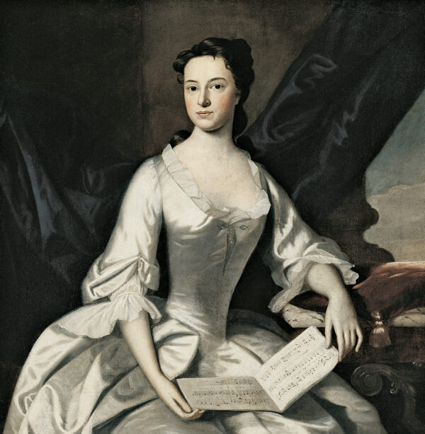 A portrait of a woman in a white dress holding a music book on her lap.