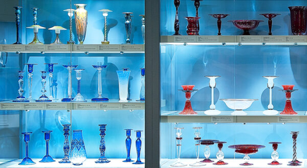 Interview view of display case filled with glass works