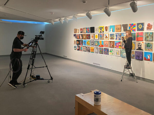 Man with a television camera intervie