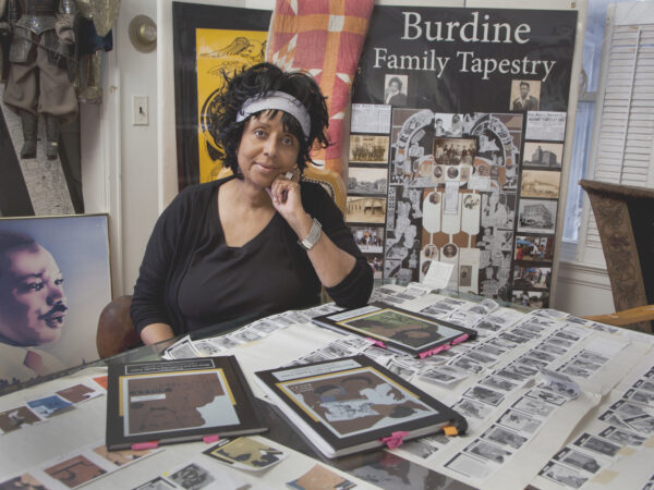 Woman sitting at a table in an art studio
