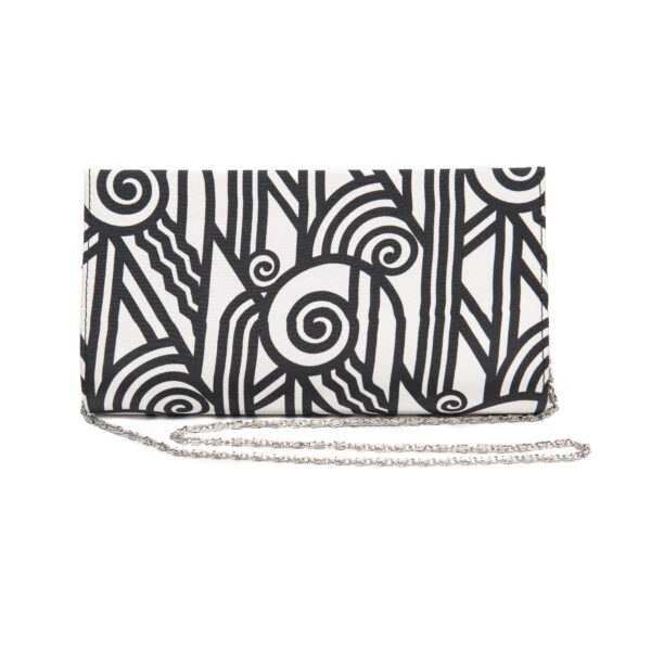 Clutch purse in a black and white geometric pattern with a silver chain
