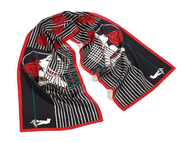 Scarf with an art-deco inspired print featuring a woman holding a rose to her face in black, red, and white.