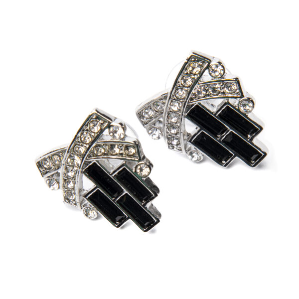 Earrings with crystals in an X-shape over descending black stones