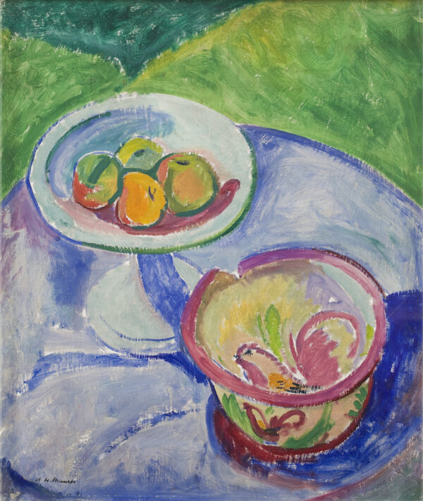 Still life of bowls of fruit on a white and green background